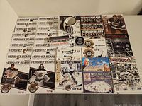 Overview photo showing arranged scoresheets, yearbooks, Christmas card, stickers, and decals with hockey imagery and Hershey Bears branding