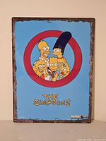 Front view of the Arcade1Up The Simpsons metal sign showing the full graphic and condition.