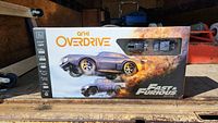 Front view of Anki Overdrive Fast & Furious Limited Edition box showing images of two cars and box artwork.