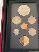Full view of the 1995 Canada proof coin set in black display case showing all seven coins.
