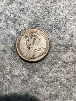 Obverse side of 1917 Newfoundland 25 cents coin showing King George V portrait.