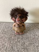 Front view of the Nyform Boy Troll figurine showing facial features, hair, and pose against a neutral background.