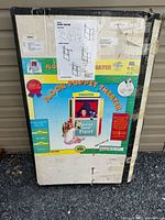 Front of boxed Guidecraft Floor Puppet Theater showing product image and branding