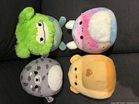 Front view of four Squishmallows plush assorted characters
