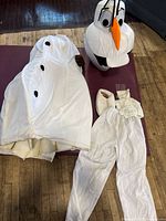 Full costume layout showing head, body suit, pants, shoe cover and cuff