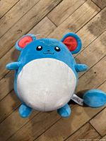 Front view of Marill plush showing colors, ears, belly, facial embroidery