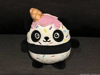 Front view of the Sprinkle Panda plush showing frosting, cone and sprinkles