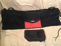 Front view of trunk organizer and visor organizer showing size difference and colors