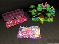 Playset, open egg case with 12 figures, collector insert displayed