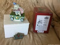 Front view of Dumbo Train figurine on foam with box and hang tag