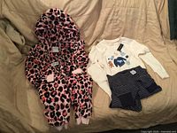 Both pyjama sets laid out