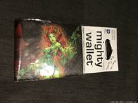 Front of Tyvek wallet in original packaging showing Poison Ivy artwork and Mighty Wallet branding