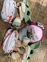 Two Grogu plush toys and Grogu cap with tags