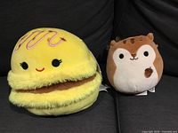 Front view of both Squishmallows showing faces and size comparison