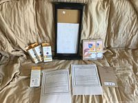 Overview of voucher sheets, wooden signboard, invitation packs, UVA/UVB detector dot packs