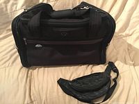 Samsonite carry-on bag front view with fanny pack