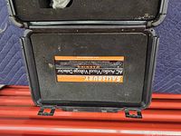 Inside of the case lid with safety and product information label