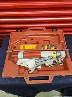 Loadbuster BAC5 Loadbreak Tool placed inside orange molded carrying case shown closed upright.