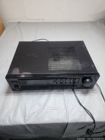 Pioneer SX-240 stereo receiver viewed from front and top angles showing the vented top panel and front control layout