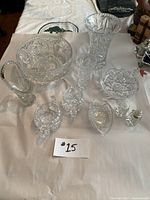 Full set of 10 crystal and pressed glass pieces arranged on fabric, showing overall condition and style