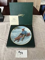 Collector's plate in green display box with Certificate of Authenticity, showing plate and packaging together.
