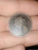 Obverse side of the 1891 Victorian half penny showing Queen Victoria's portrait in circulated condition.