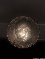 Obverse side of the 1976 Eisenhower Bicentennial dollar coin showing profile of Dwight D. Eisenhower with inscriptions.