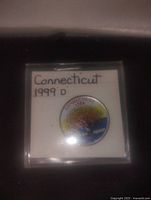 Colorized 1999 Connecticut quarter in a 2 inch protective flip with label