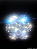 Close-up image of a snowflake-shaped brooch with multiple bright, clear rhinestones reflecting light on a black background.