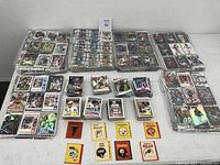 Overview of all football cards and vintage NFL team stickers included in lot.