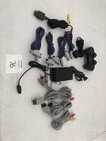 Overview of all cables, power supply, and controller included in the lot.
