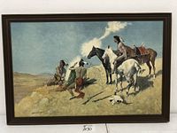 Framed painting showing Native American warriors with horses in desert, large size 41x27 inches.