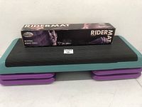 Full view of the exercise step platform with four purple risers and the Ridermat box on top.