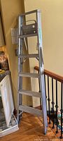 Full view of the six-foot aluminum step ladder showing entire frame and steps.