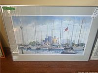 Full front view of the framed Toronto marina print showing sailboats and city skyline including the CN Tower.