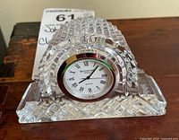 Full view of Waterford crystal desk clock showing the clear arch-shaped crystal with cut patterns and visible clock face.