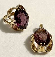 Photo showing 18K HGE ring and matching pendant side by side on white surface.