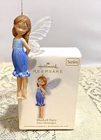 Photo of the Bluebell Fairy hanging ornament displayed beside its original Hallmark Keepsake box.