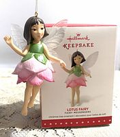 Front view of the Hallmark Keepsake Lotus Fairy ornament with its original box showing the product image.