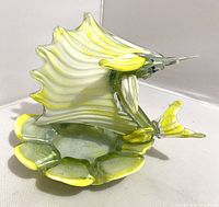 Murano glass sailfish candy dish showing the full item from the left side, highlighting the large sail fin and tail in clear and yellow glass.