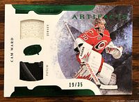 Front of the Cam Ward jersey/patch card showing three swatches and serial number 19/35.