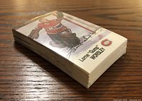 Stack of 48 hockey trading cards showing a partial view of a card featuring Lorne 'Gump' Worsley in Montreal Canadiens gear.
