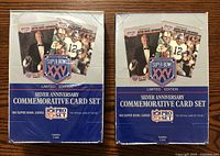 Two unopened NFL Pro Set Silver Anniversary Commemorative Card Set boxes side by side, showing front packaging with Super Bowl XXV branding and player images.