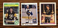 Three NHL hockey cards displayed side by side: George Ferguson (North Stars/Pittsburgh Penguins uniform), Rob Ray (Buffalo Sabres uniform), Tom Tilley (St. Louis Blues uniform), each signed on the front.