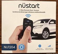 Front of box showing brand, system type (1-way remote start), model NU1204, digital ready, 1500-ft max range, and image of remote with SUV.