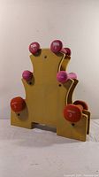 Yellow weight tree holder with six weights arranged on it (3 types).