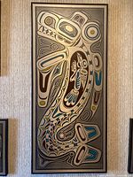 Full frontal photo of the framed Indigenous art print showing the complete design and frame on a textured wall.