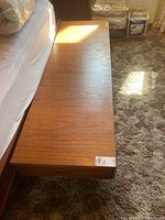 Top view of coffee table showing rectangular teak veneer surface and overall dimensions