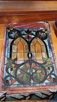 Full front view of stained glass panel on floor