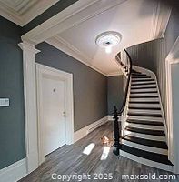 Hallway with painted grey walls and white trim; sample of interior painting work